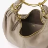 Liten hoboväska med armband i narvat läder Liten hoboväska med armband i narvat läder