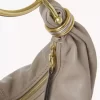 Liten hoboväska med armband i narvat läder Liten hoboväska med armband i narvat läder