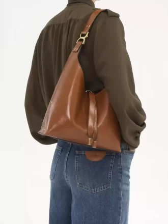 Liten Marcie hobo-väska i glansigt läder Liten Marcie hobo-väska i glansigt läder