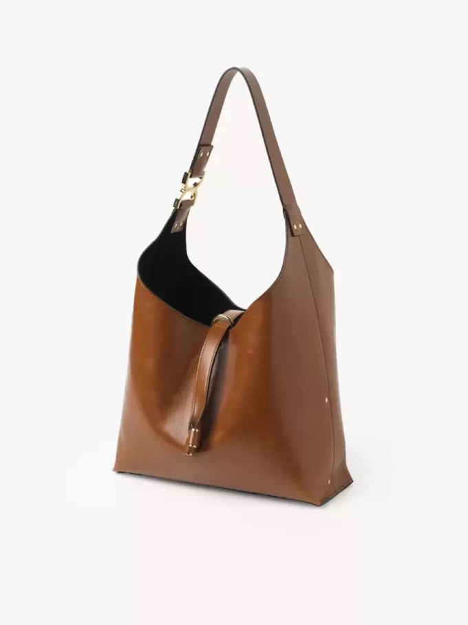Liten Marcie hobo-väska i glansigt läder Liten Marcie hobo-väska i glansigt läder