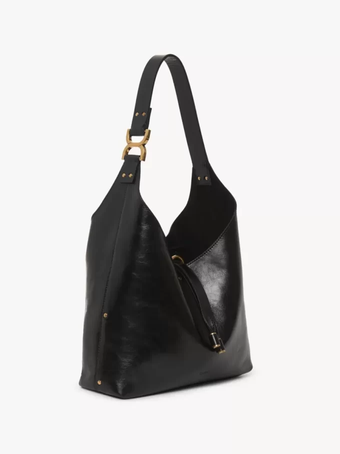 Liten Marcie hobo-väska i glansigt läder Liten Marcie hobo-väska i glansigt läder