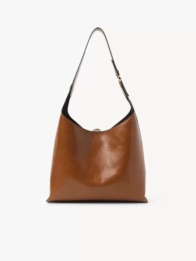 Liten Marcie hobo-väska i glansigt läder Liten Marcie hobo-väska i glansigt läder