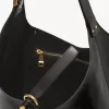 Liten Marcie hobo-väska i glansigt läder Liten Marcie hobo-väska i glansigt läder