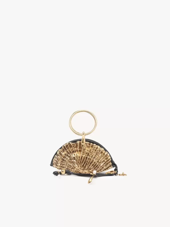 Sea Treasures kuvertväska med skal och dragkedja i mjukt läder och metall Sea Treasures kuvertväska med skal och dragkedja i mjukt läder och metall