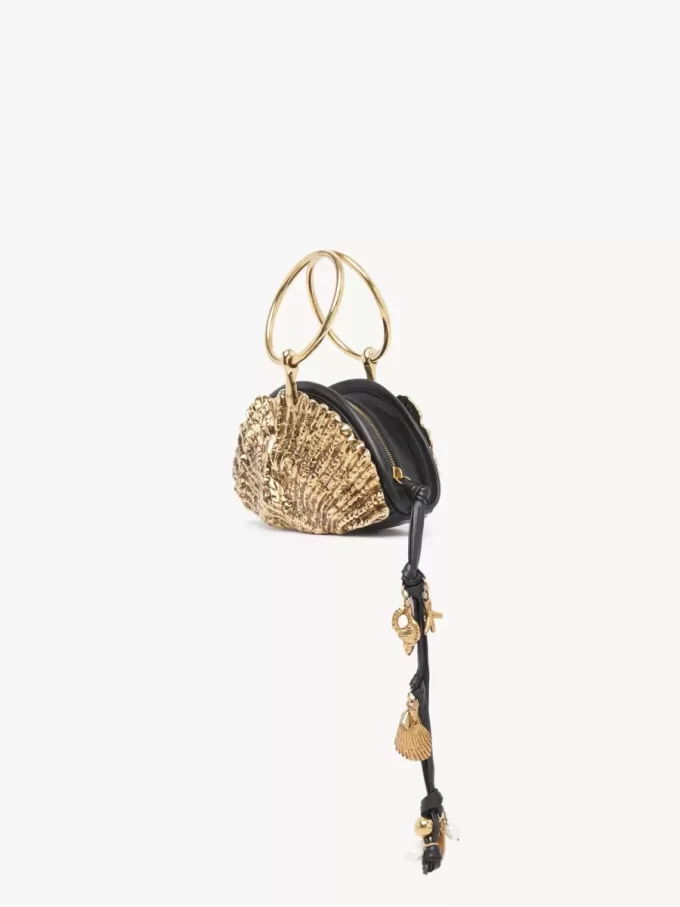 Sea Treasures kuvertväska med skal och dragkedja i mjukt läder och metall Sea Treasures kuvertväska med skal och dragkedja i mjukt läder och metall