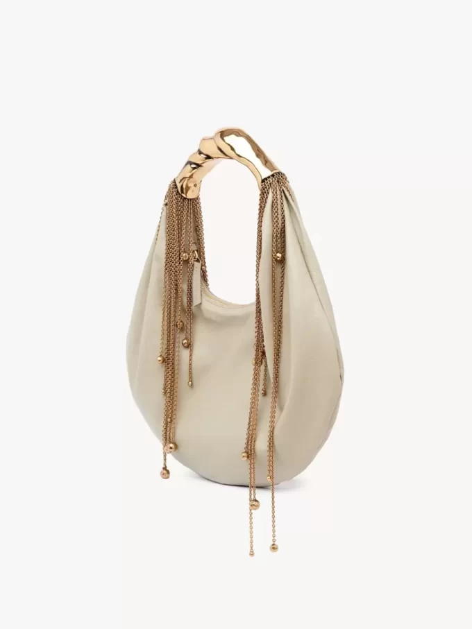 Twisted Shell hobo-väska i glansigt läder Twisted Shell hobo-väska i glansigt läder