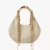 Twisted Shell hobo-väska i glansigt läder Twisted Shell hobo-väska i glansigt läder